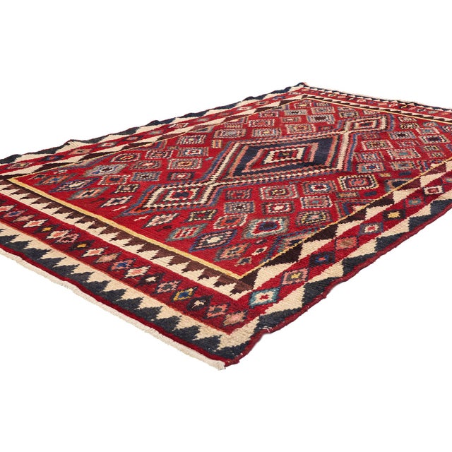 78859 Vintage Persian Lori Rug, 05'00 x 07'10. This hand-knotted wool vintage Persian Lori rug is a vibrant tableau of...