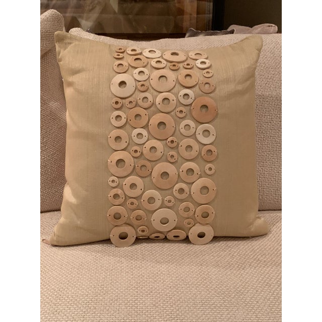 Pair of pillows with hand-sewn decorative shells. Source/Makers mark unknown.