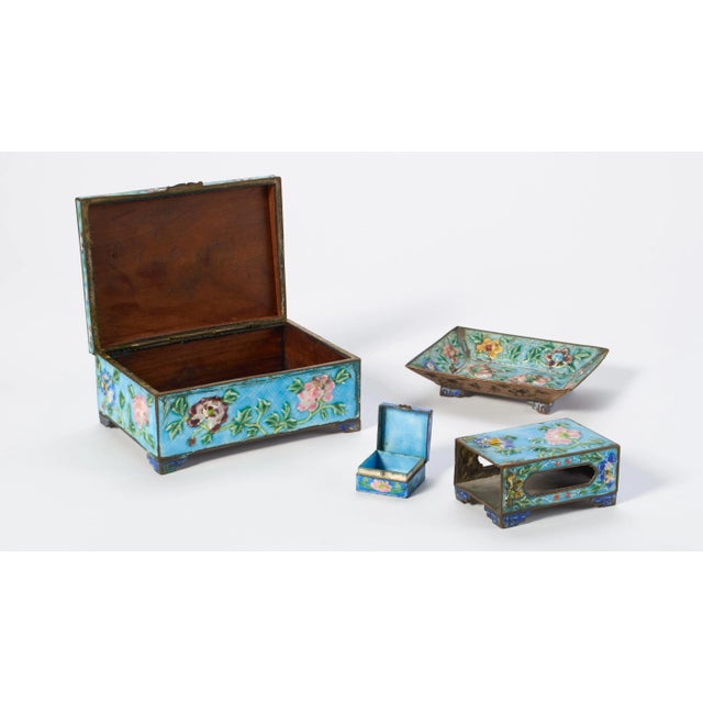 Antique cloisonné Chinese smoking set. Includes a wood lined cigarette box, ashtray, matchbox holder and tiny box (for...