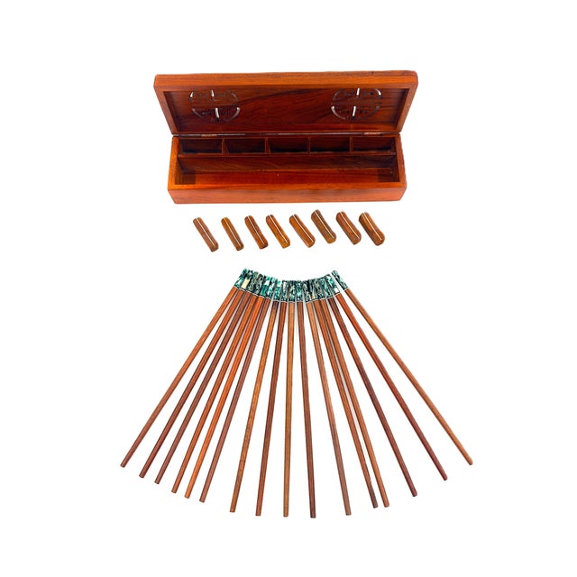 A beautiful handmade set of chopsticks finished in a warm, natural wood grain complemented by striking green and ivory...