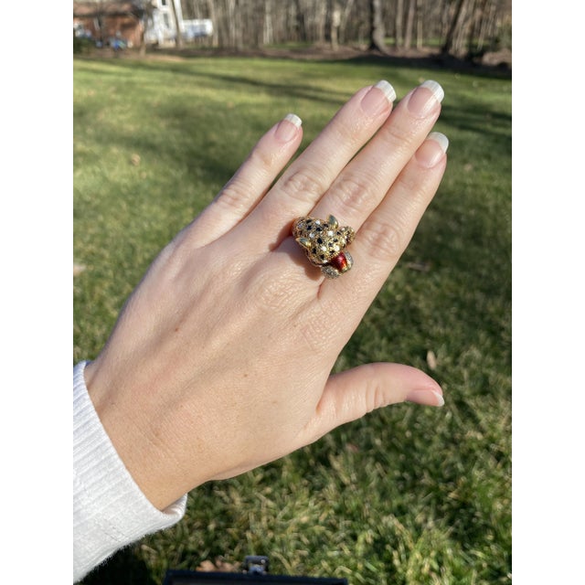 Stones: - diamonds, 22 stones - single cut round - 1.4 mm - approximately .18 total carats - rubies, 2 stones - round cut...