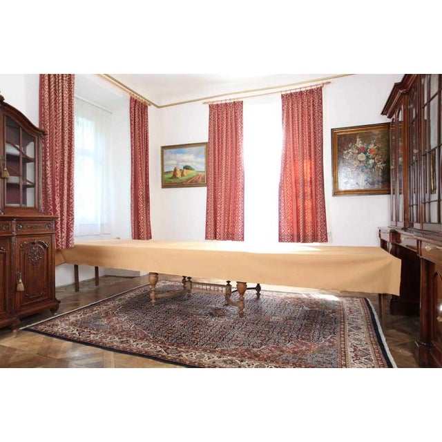 Beautiful table made of solid oak, hand-carved with floral decor and human heads. The lower part is reinforced with a...