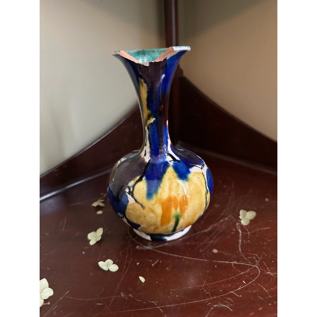 Lovely mid-century vase in vibrant drip colors. Embrace your wabi-sabi because the neck has been damaged. It’s still...