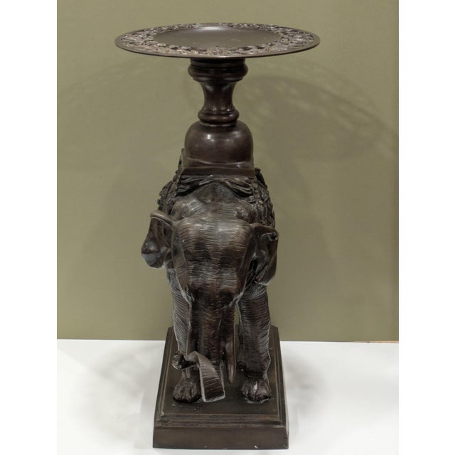 Featured is a large and heavy untagged Maitland Smith bronze elephant carrying a pedestal with a tray on top. The piece is...