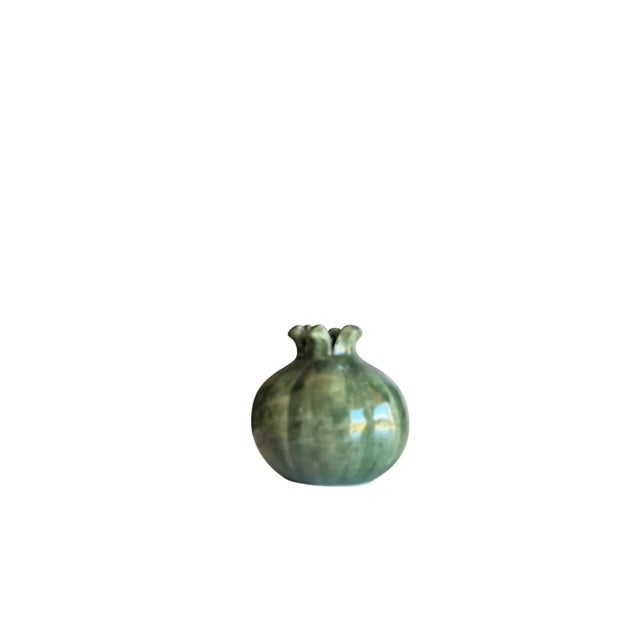 A luminous dark green glaze with visible brushstrokes makes this sculptural vase a charming accent—made in Italy...
