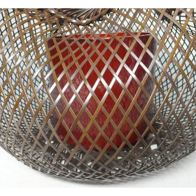 An intricately woven flower display basket used for Sencha tea ceremonies. With an undulating rim and wide network of...