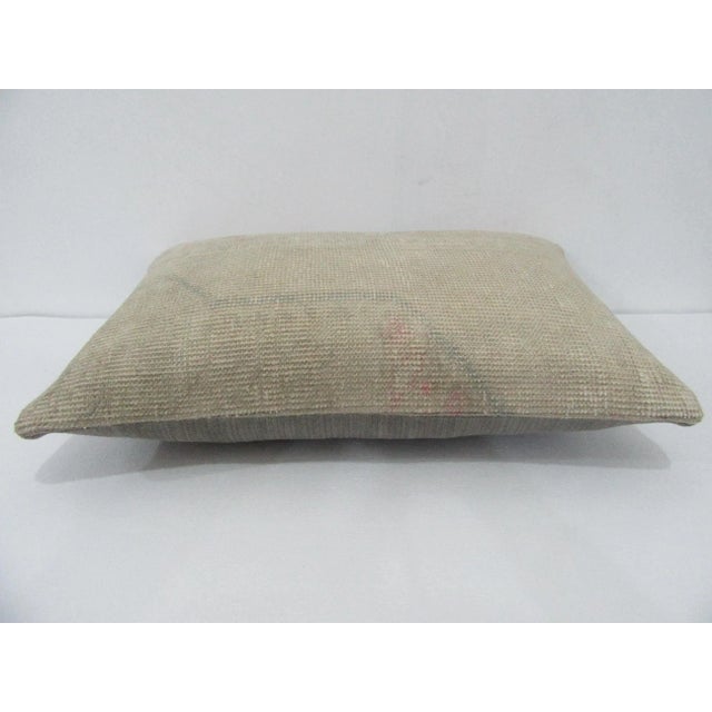 Decorative pillow cover made from a vintage Turkish handknotted rug. Backed with good quality cotton fabric. Pillow...