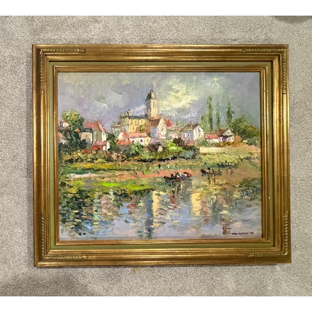 A vibrant Impressionist-style oil on canvas depicting a picturesque European riverside village with a prominent church...