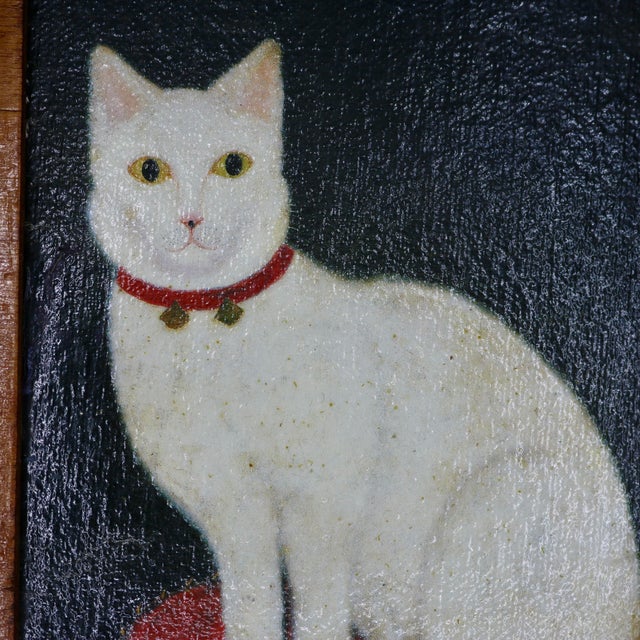 Bring an eclectic touch of Americana into your home with this striking vintage reproduction of "Tinkle, A Cat," originally...