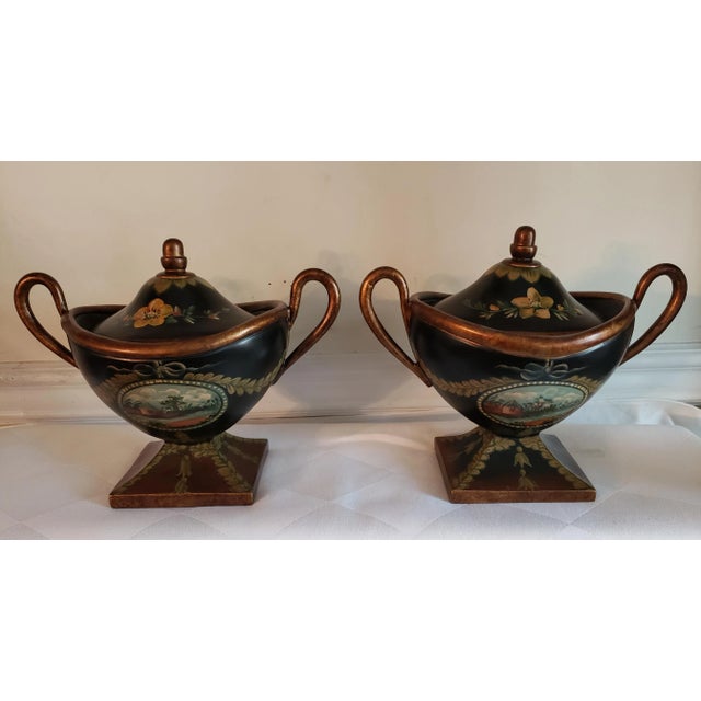 Vintage Hand Painted Decorative Ceramic Urns. Urns measure 10.5inches in width by 6.5 inches in depth and 9 inches tall