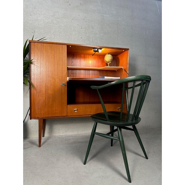 Vintage highboard secretary/storage cabinet. Period: 1950s/1960s. Finish: teak. All keys present. Tapered legs and sleek...