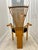 A wonderfully distinctive 1990s Postmodern armchair featuring an architectural fan-shaped back formed by slender radiating...