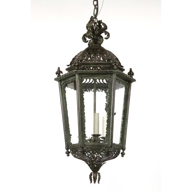 Antique French style exterior lantern pendant light made of verdigris and black finish wrought iron and six clear glass...