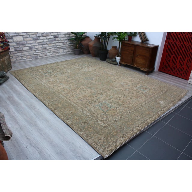 This gorgeous hand knotted traditional Vintage Turkish Anatolian area rug is approximately 60 years old in excellent...