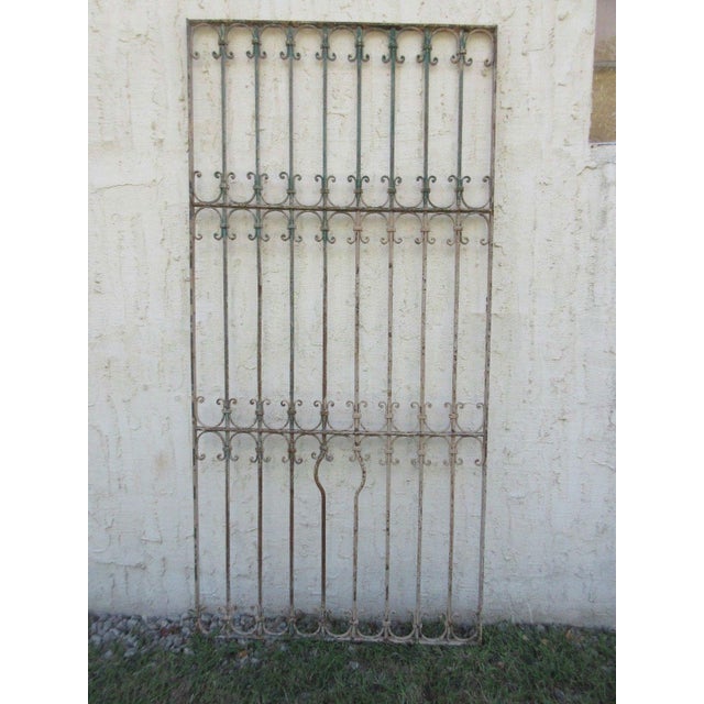 This gate is a wonderful piece of architecture. Heavy, tight and sturdy. Piece does show signs of age related wear...