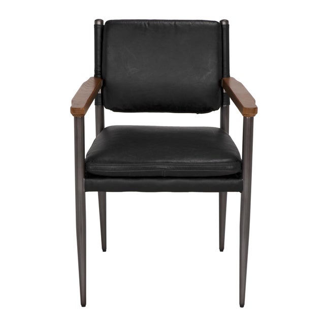 Add a touch of industrial chic to your space with the Wooster Chair. This stylish chair is constructed from a blend of...