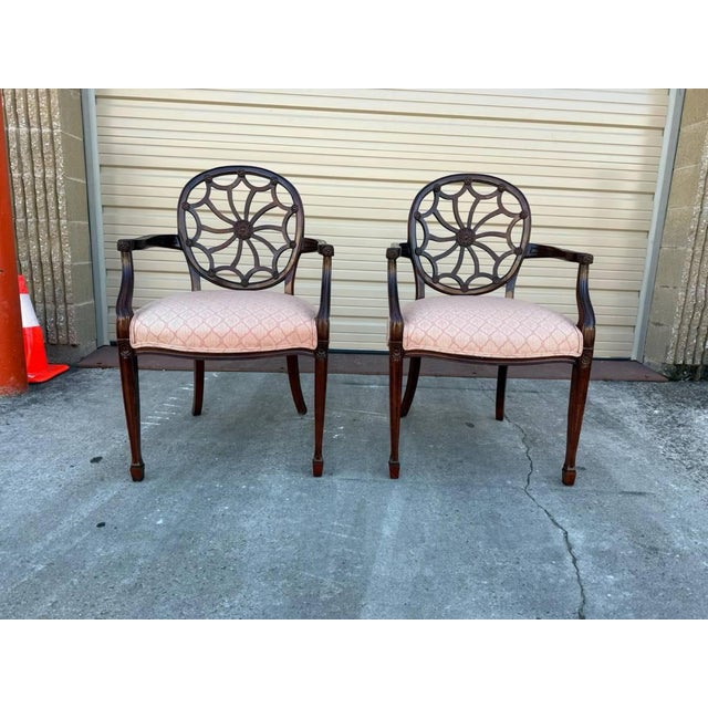 Pair of Georgian Style Carved Spiderweb Back Carved Mahogany Armchairs. Features oval-shaped backrests and spiderweb...