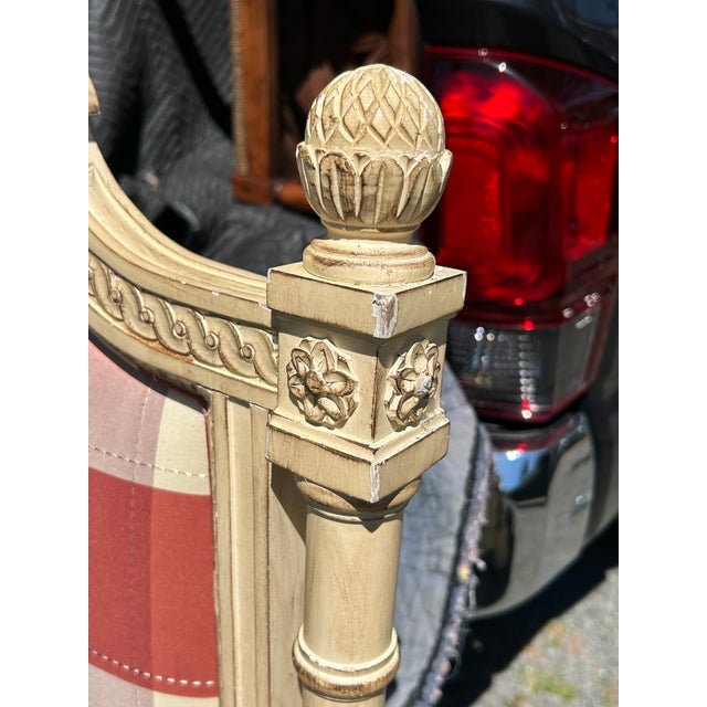 Romantic king size French Provincial style headboard having lovely detailed carvings and cream paint, complimented by...