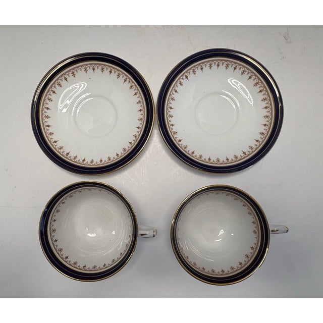 Set of two vintage Aynsley teacups and saucers in the elegant Leighton pattern, number 1646. Crafted in England from fine...