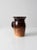 This hand-crafted studio pottery pitcher by Brian Marx features a rich two-tone glaze in deep chocolate and tawny brown....