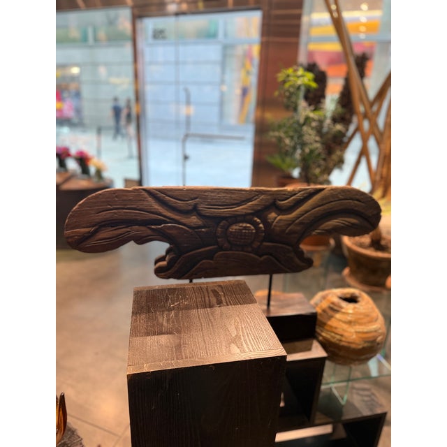Beautifully carved ntique Chinese architectural fragment. Carved with different motifs on both sides set on a wood stand....