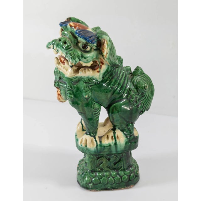 We are selling this antique Chinese Sancai type pottery figure of a standing foo dog or lion. The figure has a hole on the...