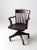 This antique Johnson Chair Company swivel desk chair showcases an early 20th-century design with a refined slat back,...