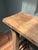 Crafted from solid reclaimed wood, this handcrafted console table showcases the natural beauty and character of aged...