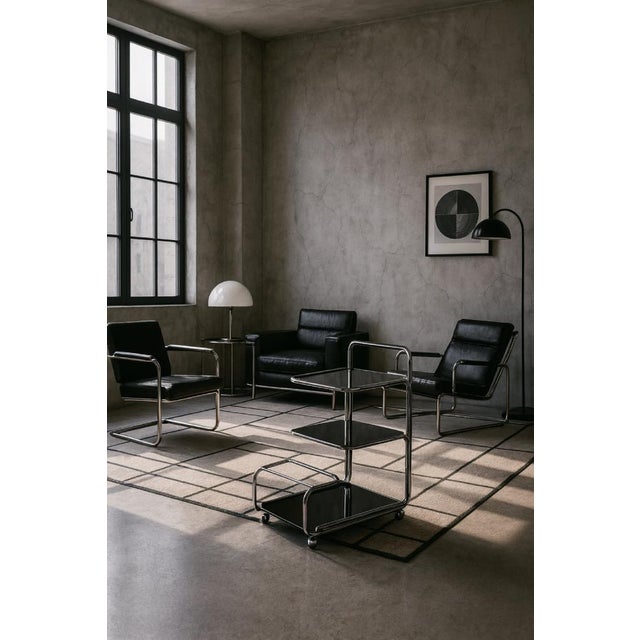 This modernist bar cart was manufactured in Germany during the 1960s. The bar is crafted from chrome-plated tubular steel...