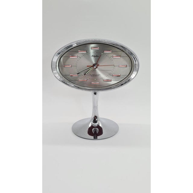 The Japanese RHYTHM alarm clock from the 1970s is an example of Space Age design, characteristic of the retro-futuristic...
