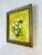 The painting features a still life of white daisies with yellow centers, arranged in a vibrant green vase. The flowers are...