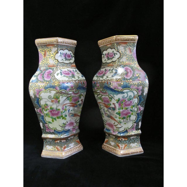 20th century Chinese Famille Rose porcelain wall pocket vase pair. Each has a flat back with perforations so they can...