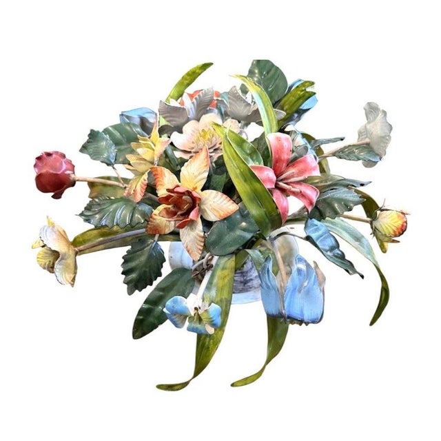 A charming, vintage tole floral arrangement. Features hand painted blooms in various shades, surrounded by green leaves...
