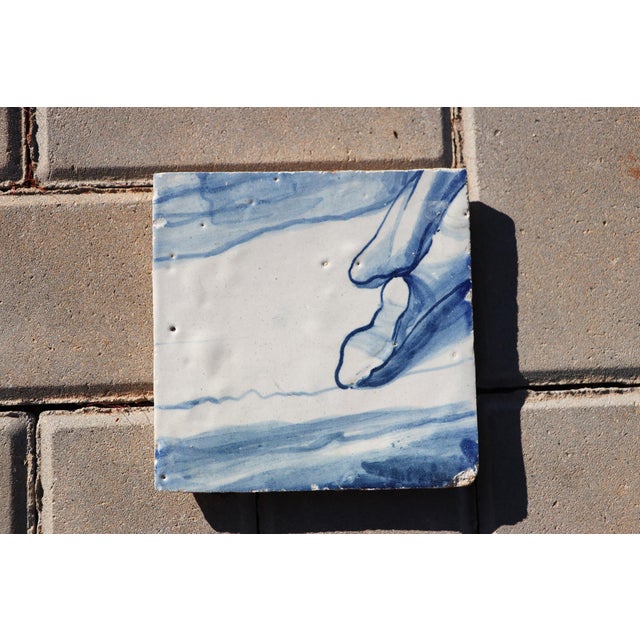 Circa: 18th Century. Country: Portugal. Material: Earthenware, Tin-glazed pottery. Note: This tile was once part of a...