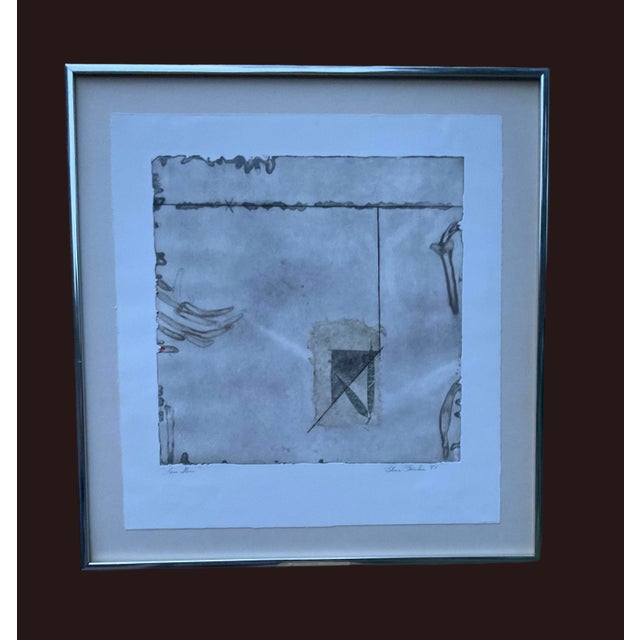 Original abstract mixed media collage on paper, signed by artist and titled “Love Stone” Infused into a matted boarder it...