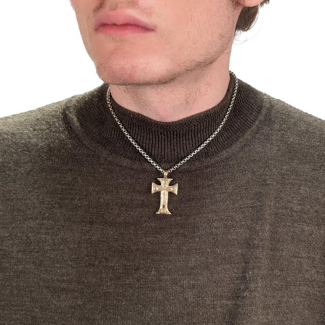 A fine, signed Byzantine or Greek Orthodox pendant cross. By Konstantino. In sterling silver with a wave and floral...