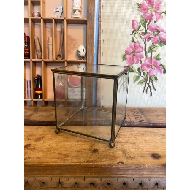 Brass metal and glass materials. Beautiful patina and character. Can be used for trinkets or jewelry.Vintage condition as...