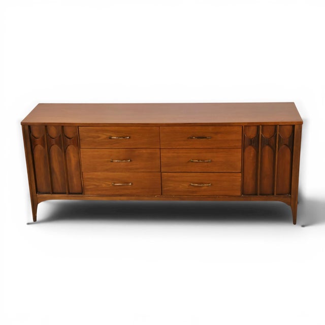 This 1960s Kent Coffey Perspecta lowboy dresser is a striking example of sculptural mid century modern design. The long...
