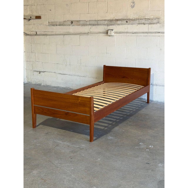 Crafted in Denmark, this bed showcases clean Scandinavian lines and rich teak wood grain. The warm organic finish...