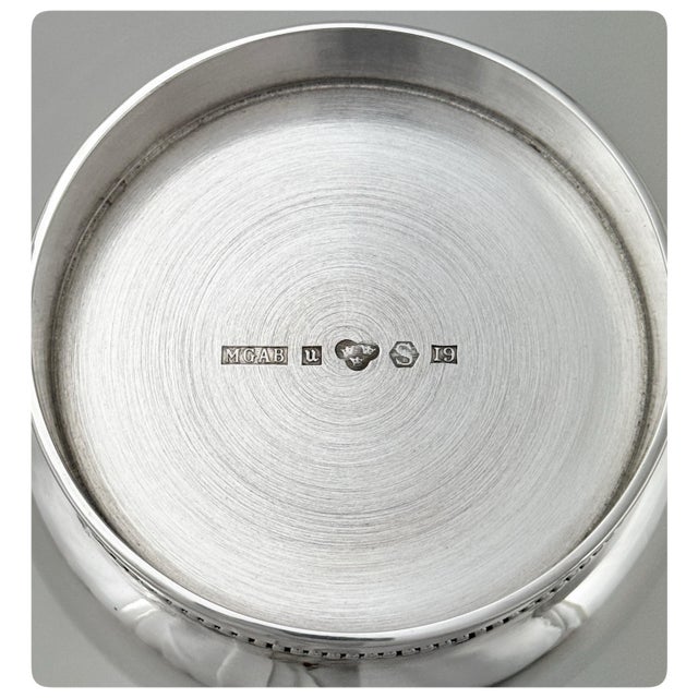 This elegant Swedish silver vase showcases the refined aesthetics of mid-century modern design. Crafted from solid...