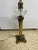 Antique brass classical reeded Corinthian column on a marble base with a cut crystal glass spirit or oil reservoir. Was an...