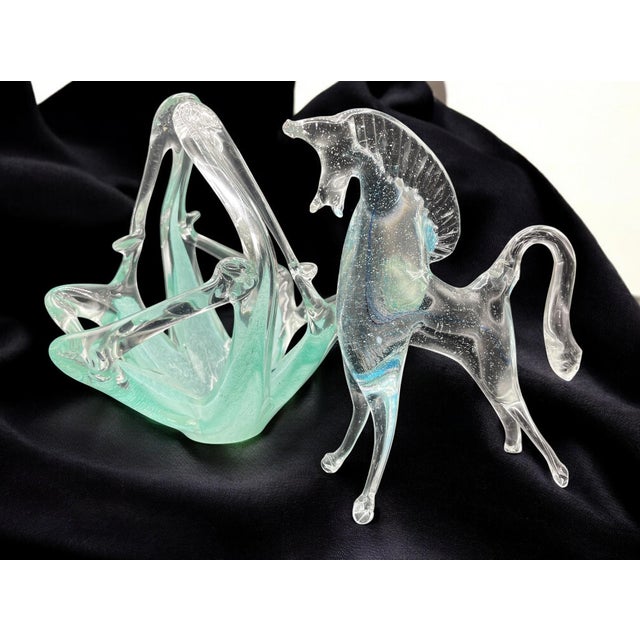 Murano – Turquoise Glass Basket The Murano glass basket is a mid-century design object, made with the famous Murano glass....