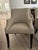 A set of 6 Dining Chairs by Bernhardt Furniture. Chairs are accented with pewter nailheads and legs are finished in a...