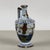 This charming faenza ceramic jug is a valuable collector's piece with a distinct historical edge. Likely made by the calf...