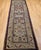 A striking example of 19th-century Caucasian village artistry, this antique Kazak runner features the bold geometric...
