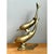 This vintage brass sculpture captures two dolphins in a playful, spiraling dive. The pair is cast in solid brass and...