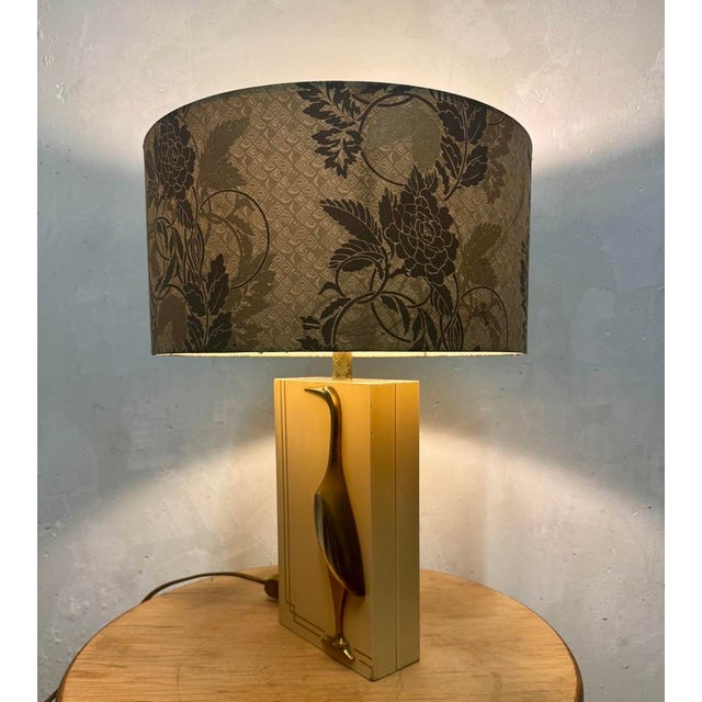 beige lacquered, brass bird, wear on the base. This piece has an attribution mark, I am sure that it is completely...
