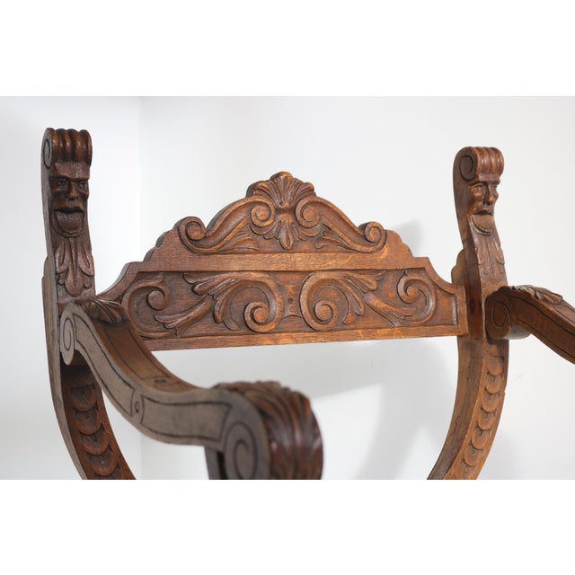 Beautiful 19th-century oak Dagobert-style armchair and folding footstool, both featuring luxurious upholstery in stunning...