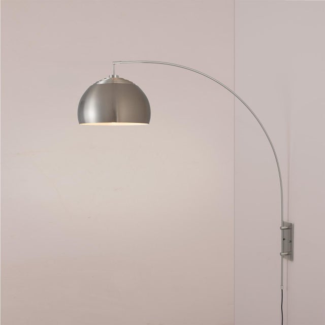 Featuring a space-saving design, the Half Dome Wall Mounted Arc Lamp by Peter Morelli is a Modern wall light with a Satin...