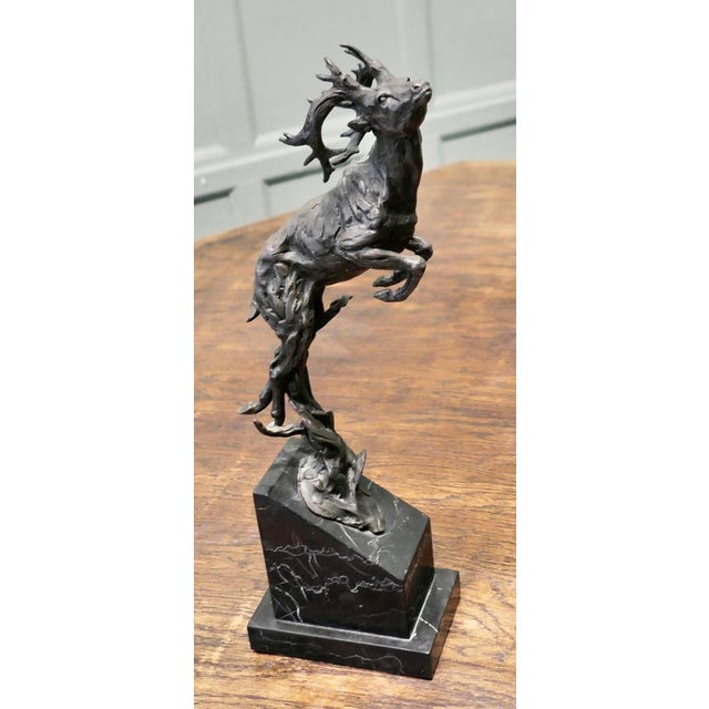 This is a Signed Bronze Sculpture of a Deer Jumping, Mounted on a Marble Plinth A great piece on a Hunting theme signed by...